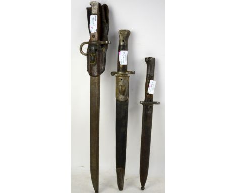 19th century dagger/bayonet with wooden handle  leather and metal sheath, 51cm and and two others similar. 