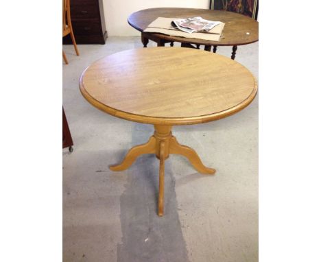 A round light wood kitchen table