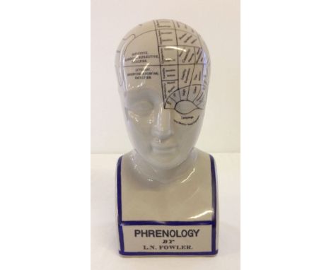 A ceramic phrenology head 29cm tall.