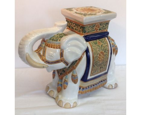 A large modern decorative ceramic elephant figure 44cm tall and 55cm long.