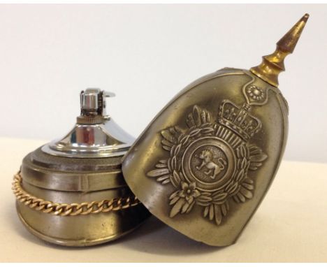 An unusual lighter in the form of a c1900 spiked army helmet.