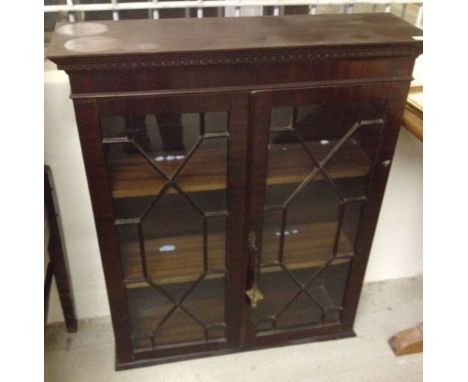 A modern 2 shelf display cabinet with fretwork decoration to glass.