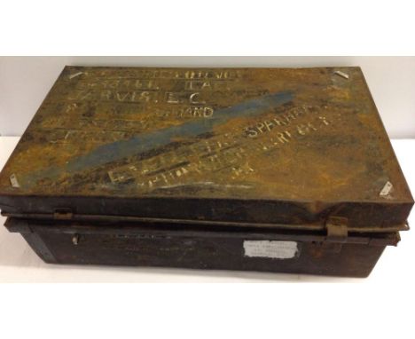 A vintage black tin travelling trunk.