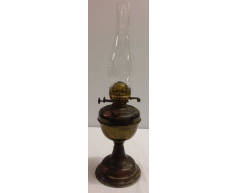 A vintage brass oil lamp.