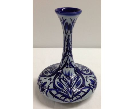 A Moorcroft " Blue on Blue" collection vase in ships decanter shape. 23cm tall. 2003