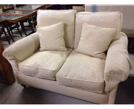 A John Lewis 'Derwent' cream 2 seater sofa.