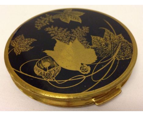 A vintage 'Mascot' ASB ladies compact with black enamel & leaf decoration.