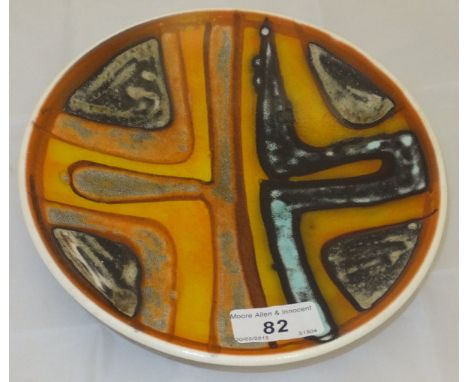 A Poole pottery shallow dish decorated in yellow, orange, blue and black