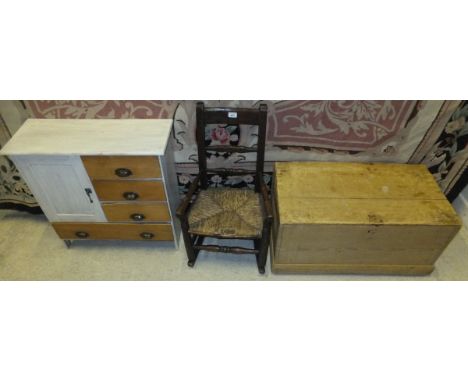 A 19th century child's beech and ash rush seat rocking chair, a pine trunk, and a miniature painted bedroom cabinet