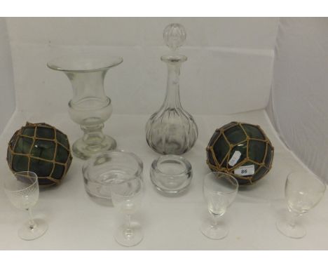 A cut glass decanter with star cut base, assorted glass vases, cut glass wine glasses, sherry glasses, etc