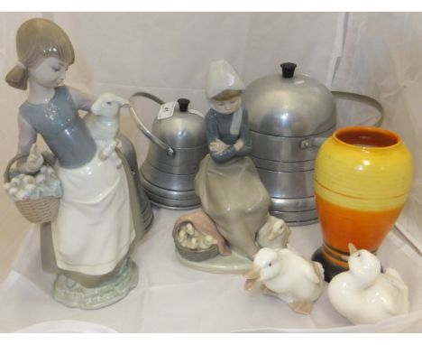 A Lladro figure of a girl with lamb and basket of vegetables, a Lladro figure of a girl with duck and basket of ducklings, tw