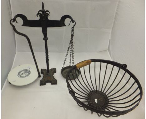 A pair of iron scales with ceramic plate marked "Parnall & Sons Limited", together with an iron basket