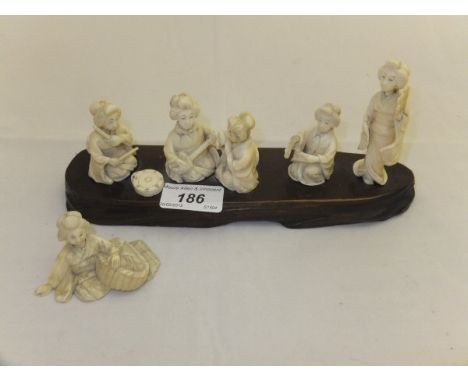 An early 20th Century carved ivory figure group comprising five various Japanese ladies in various poses including playing mu