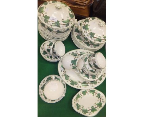 A collection of Wedgwood & Barlaston "Napoleon Ivy" pattern dinner and tea wares, to include two lidded tureens, oval platter