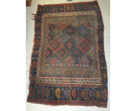 A Caucasian tribal bag panel, the centre field with a diamond shaped pattern in madder, terracotta and blue within blue, madd