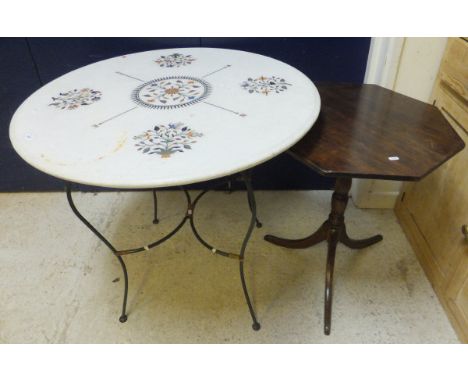 A marble topped garden table decorated with floral hardstone inlay and compass points, raised on a metal stand, together with
