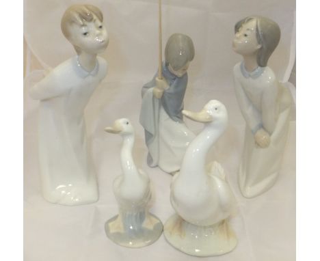 Two Lladro figures of children in nightgowns, a Lladro figure of a boy, one Lladro figure of a duck and a Nao figure of duck 