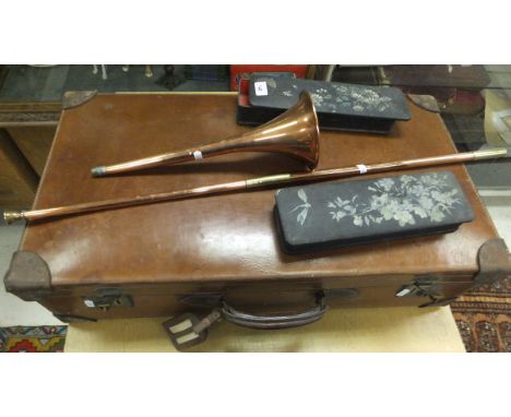 A copper and brass coaching horn, two papier-maché glove boxes, a leather suitcase and a large leather trunk / case