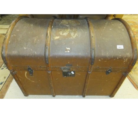 A canvas and wood bound dome topped trunk, together with a further canvas and brass studded dome topped cabin trunk