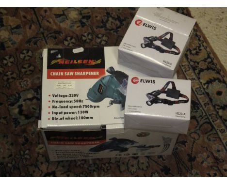 A 240 volt Neilsen chainsaw sharpener, together with two Elwis LED headlamps *