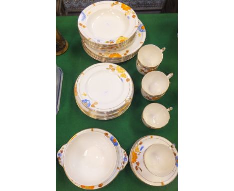 A collection of Grays pottery dinner wares painted with flowers in shades of blue, orange, yellow and brown, to include cups 