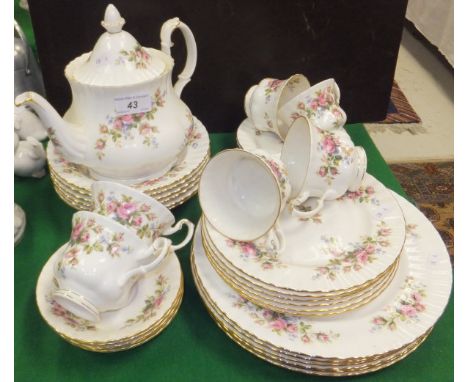 A collection of Royal Albert "Moss Rose" pattern tea wares to include teapot, cups and saucers, three sizes of plates, and bo