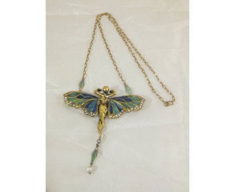 An Art Nouveau style plique a jour enamel pendant in the form of a winged woman