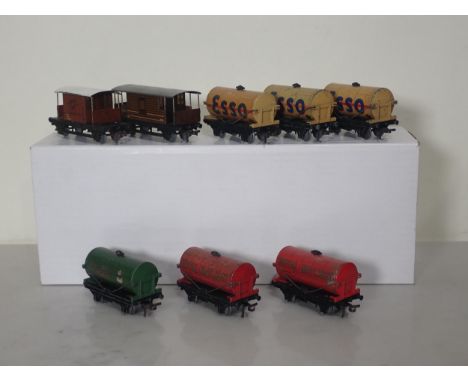 Six rare Hornby Dublo Tankers and two Brake Vans including 3x buff 'Esso', 2x 'Royal Daylight' and 'Power Ethyl' 