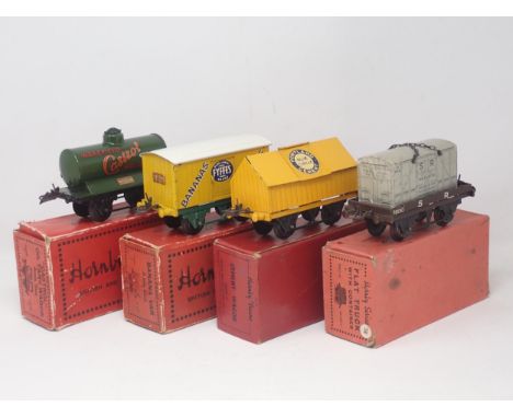 Four boxed Hornby 0 gauge Wagons including SR Flat Truck with container, 'Fyffes' Banana Van, 'Castrol' Oil Tank and Cement W