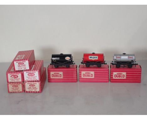 Eight Hornby Dublo Tank Wagons comprising 2x 4676 'Esso', 4675 Chlorine, 4677 'Mobil', 4678 'Shell' 2x 4680 'Esso' and 4679 T