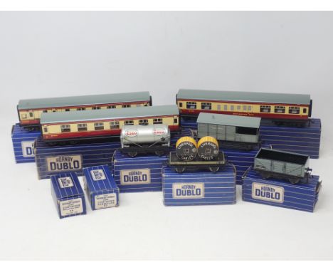 Two boxed Hornby Dublo D12 Corridor Coaches, a D20 Restaurant Coach, four D1 Wagons including 'Esso' Petrol Tanker, BR Goods 