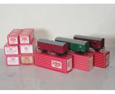 Nine Hornby Dublo Wagons comprising 4315 BR Horse Box, 4316 SR Horse Box, 4323 SR Utility Van, 4305 Passenger Fruit Van, 4685