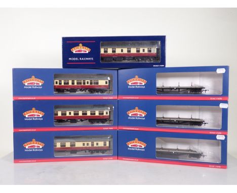 Four boxed Bachmann 00 gauge crimson and cream Mk1 Corridor Coaches and three boxed Bogie Bolster Wagons 