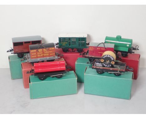 Six boxed Hornby 0 gauge Wagons including Flat Truck with container, No.1 'Manchester Oil Refinery' Tank Wagon, two No.50 Low