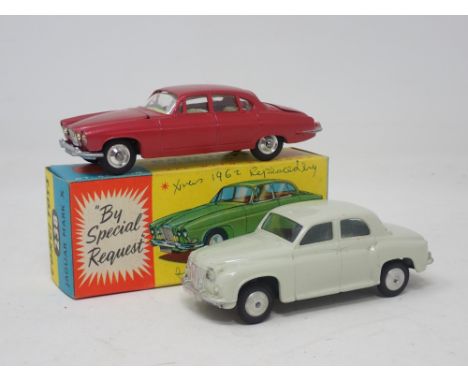 A boxed Corgi Toys No.238 metallic maroon Jaguar Mk10 (box with biro writing on one side_ and an unboxed Corgi Toys white Rov