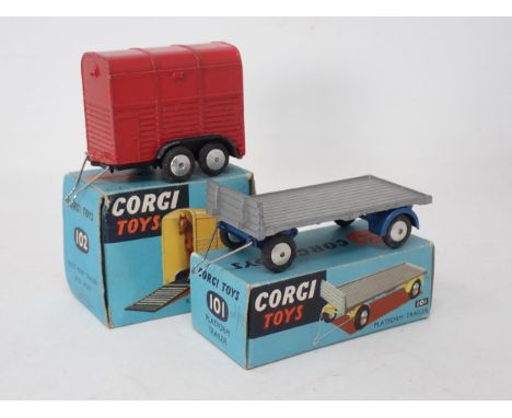 A boxed Corgi Toys No.101 Platform Trailer and a boxed No.102 Rice's Pony Trailer with pony 