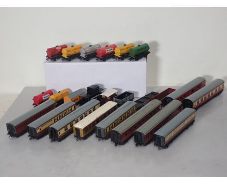 Ten unboxed Hornby Dublo Coaches including LNER, GWR and BR and thirteen Wagons including 'Mobil', 'Shell' and 'Power Ethyl' 