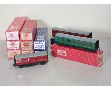 Ten Hornby Dublo Coaches comprising boxed 4025 and 4026 Suburban Coaches, 2x D14 boxed Suburban Coaches (one flap on box miss