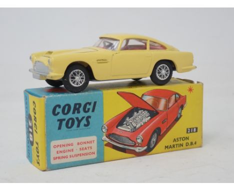 A boxed Corgi Toys No.218 yellow Aston Martin DB4 