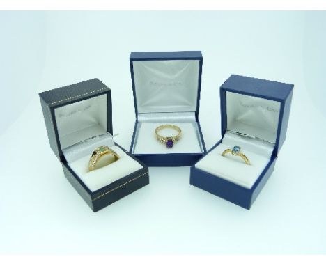 Rocks & Co.; Three Rings, one set aquamarine with two small diamonds either side, mounted in yellow gold, marked 375, Size S,