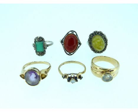 Six various Rings, including an oval amethyst set ring with yellow triangular stones on the shoulders, one small opal and sap