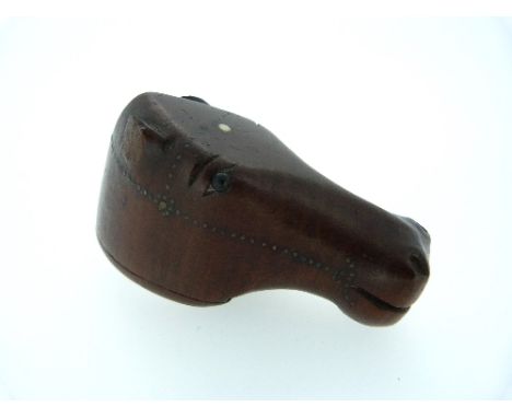 A Georgian mahogany snuff box in the shape of a horse head, with black bead eyes and decorated with brass studs, lacks ears, 