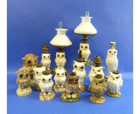 A pair of continental porcelain Owl oil lamps, with glass shades and funnels, overall 15in (38cm) high, together with nine po