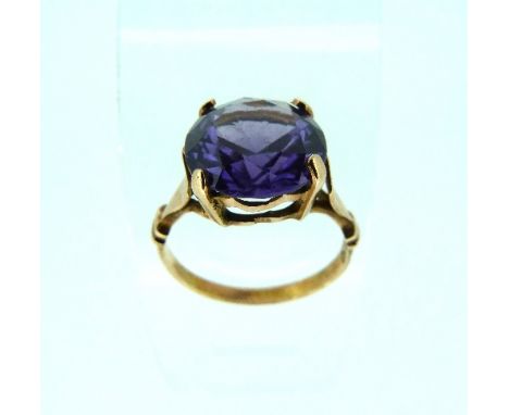 A Ring, set with a brilliant cut amethyst mounted in yellow metal with foreign mark, Size K½.