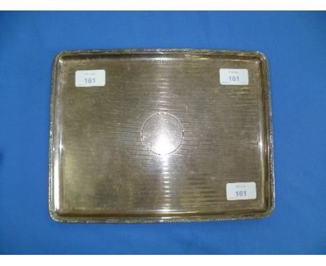 A silver dressing table Tray, hallmarked Birmingham, 1924, of rectangular form with rounded corners and engine-turned decorat