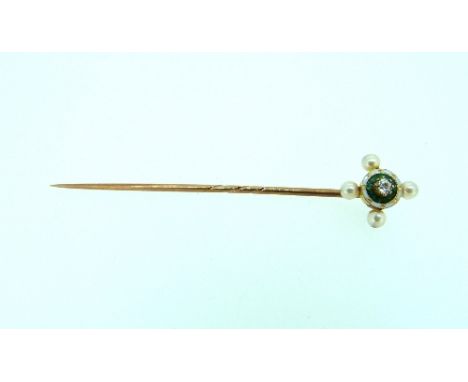 A Stickpin, with yellow metal pin, and circular finial with central diamond and green and white enamel around, with four seed
