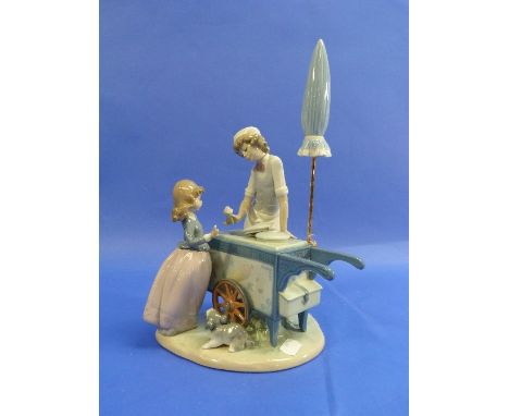 A Lladro porcelain 'Ice Cream Vendor' group, no.5325, 12¼in (31cm) high, boxed, with packaging. 