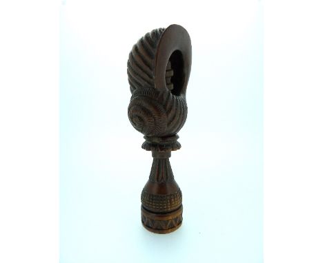 An antique Treen carved mahogany screw-type Nut Cracker, in the form of a shell, 4¾in (12cm) long. 