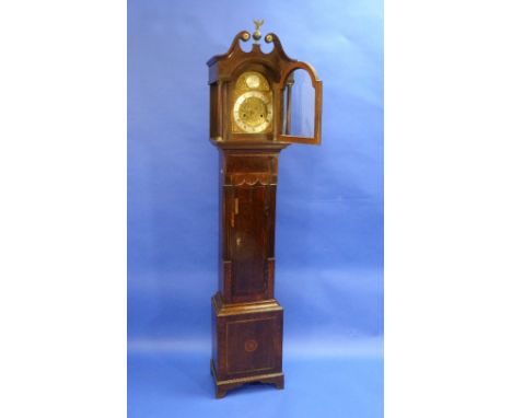 An early 19thC mahogany eight day Grandmother Clock, striking on a bell, the silvered chapter ring with Roman and Arabic nume