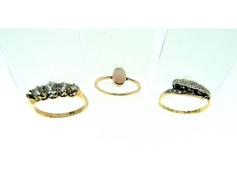 A small oval opal Ring, in yellow metal, Size N together with a 9ct yellow gold ring, set with small Zircons and one missing,